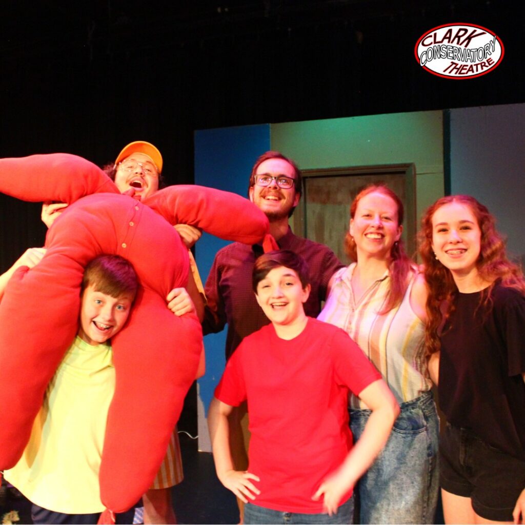The production team and cast of Clark Conservatory's Doors poses for a photo.